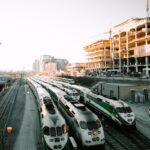 white and green bus on road during daytime